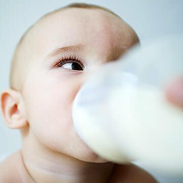 baby drinking bottle of milk