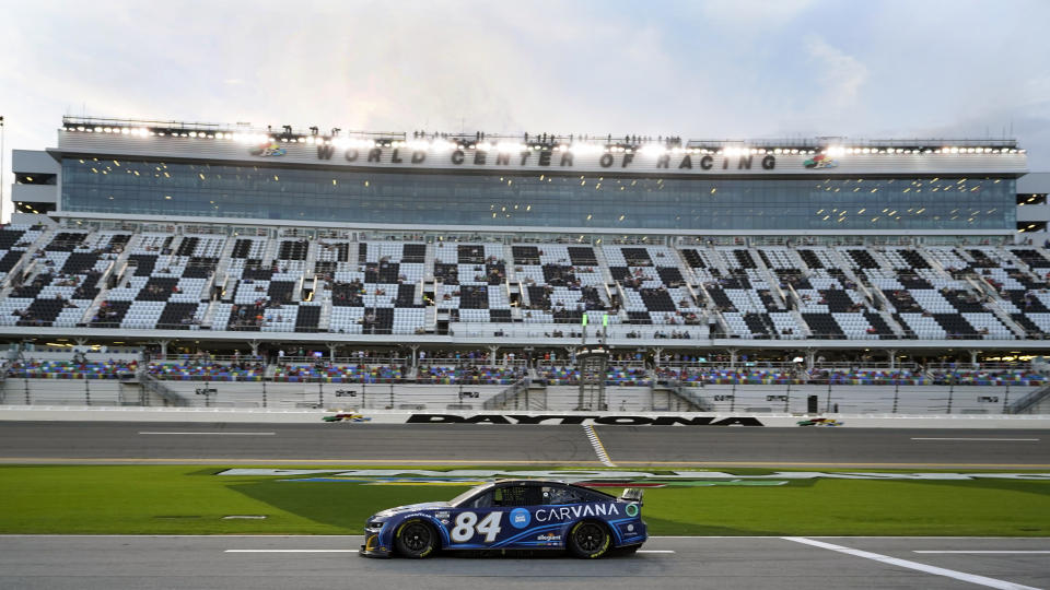 Jimmie Johnson (84) drives down pit road during a practice session for the NASCAR Daytona 500 auto race at Daytona International Speedway, Friday, Feb. 17, 2023, in Daytona Beach, Fla. (AP Photo/John Raoux)