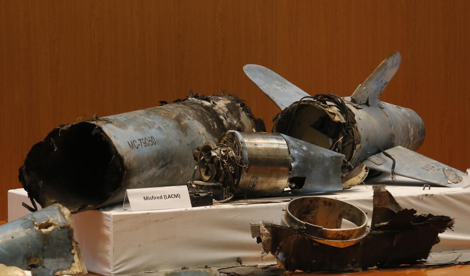 Remains of what was described as a misfired Iranian cruise missile used in an attack this weekend that targeted the heart of Saudi Arabia's oil industry, is displayed during a press conference by Saudi military spokesman Col. Turki al-Malki, in Riyadh, Saudi Arabia, Wednesday, Sept. 18, 2019. Though Yemen's Houthi rebels claimed the assault, the U.S. alleges Iran was behind it. (AP Photo/Amr Nabil)