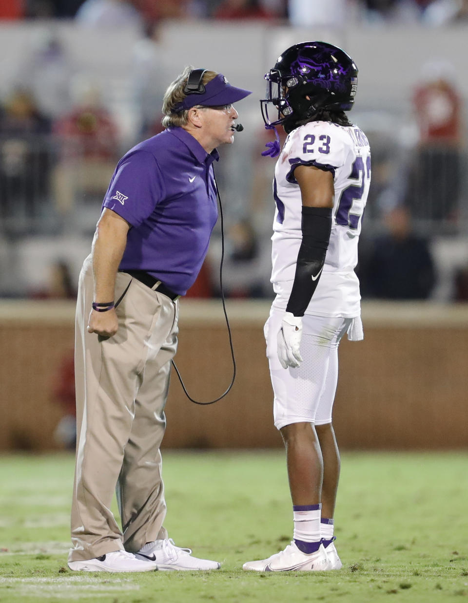 TCU coach Gary Patterson talks to cornerback Keontae Jenkins (23) during the second half of the team's NCAA college football game against Oklahoma, Saturday, Oct. 16, 2021, in Norman, Okla. Oklahoma won 52-31. (AP Photo/Alonzo Adams)