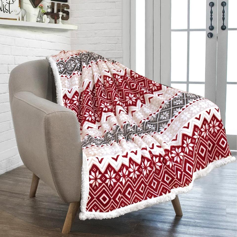 <p><a href="https://www.amazon.com/PAVILIA-Christmas-Decoration-Reversible-Microfiber/dp/B07XVSLD7V/ref=sr_1_10?crid=1JQIIZS5UMZ50&keywords=christmas+blanket&qid=1695142626&sprefix=christmas+blanket%2Caps%2C78&sr=8-10&tag=syn-yahoo-20&ascsubtag=%5Bartid%7C2164.g.45208747%5Bsrc%7Cyahoo-us" rel="nofollow noopener" target="_blank" data-ylk="slk:Shop Now;elm:context_link;itc:0;sec:content-canvas" class="link ">Shop Now</a></p><p>Fair Isle Christmas Blanket</p><p>$19.99</p><span class="copyright">Amazon</span>