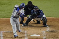 Los Angeles Dodgers' Corey Seager hits a home run against the Tampa Bay Rays during the third inning in Game 4 of the baseball World Series Saturday, Oct. 24, 2020, in Arlington, Texas. (AP Photo/Sue Ogrocki)