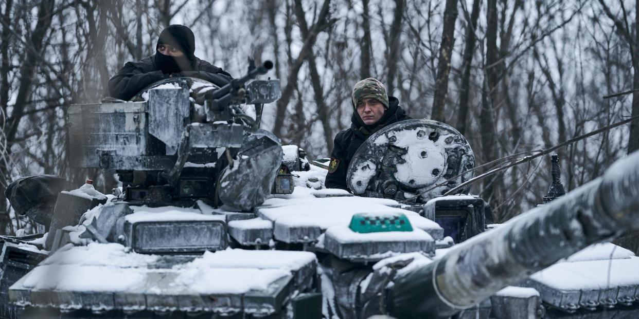 A Ukrainian tank rides to its position in the frontline in Bakhmut, Donetsk region, Ukraine, Sunday, Feb. 12, 2023.