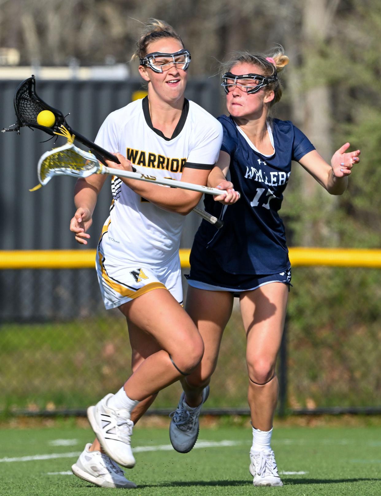Bailey Lower of Nantucket attempts to stop a drive by Sienna Reeves of Nauset.
