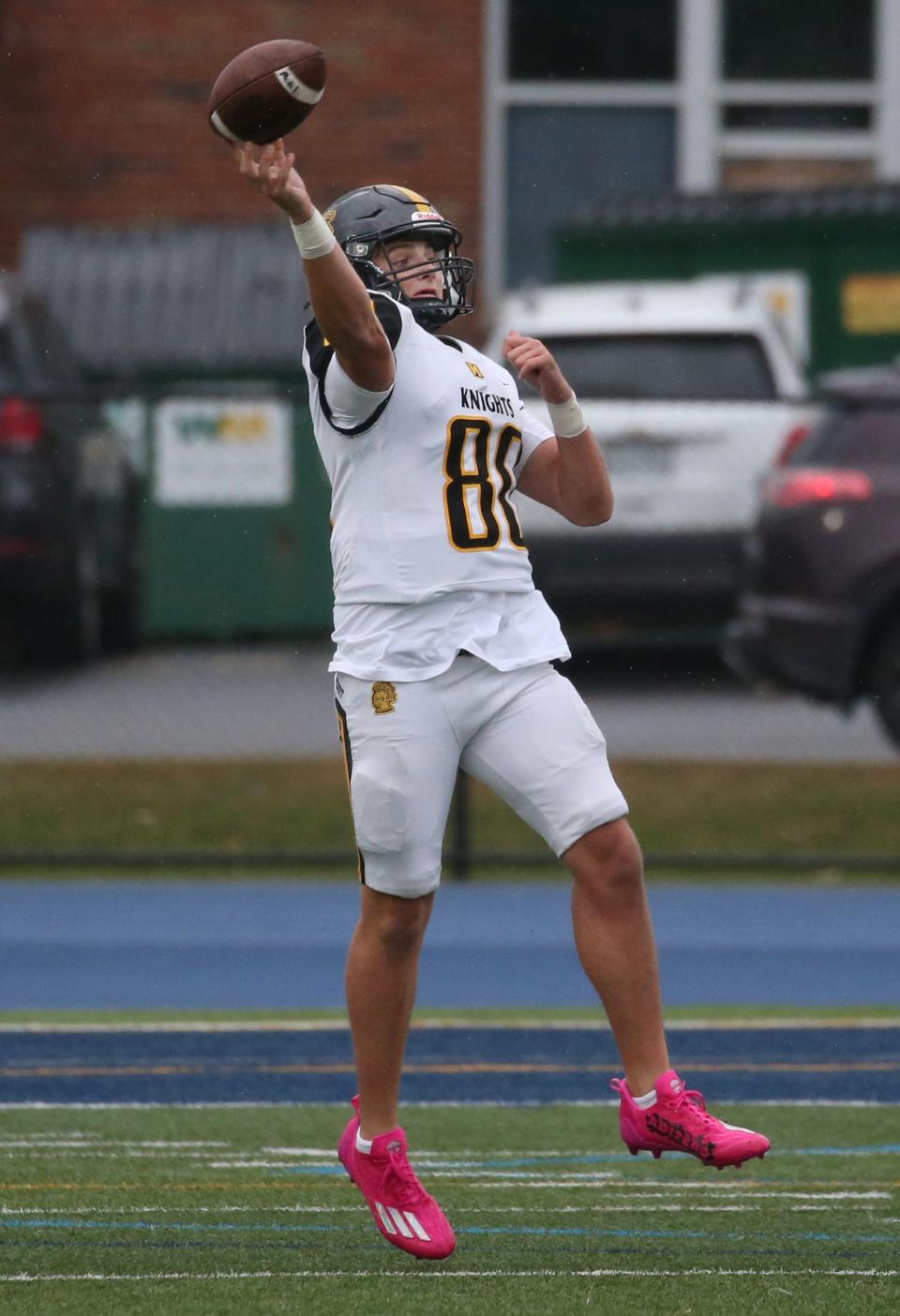 McQuaid quarterback Will DiMarco throws on the run.