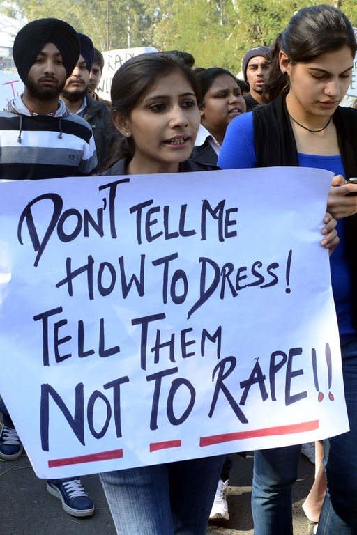 Indian students holds placards as they shout-slogans against a recent rape that took place in New Delhi during a protest in Amritsar on December 20, 2012. Despite an outpouring of anger at a student's gang-rape, observers say misogyny remains widespread in India where sex assaults are often dismissed as "teasing" and victims find themselves blamed for attacks