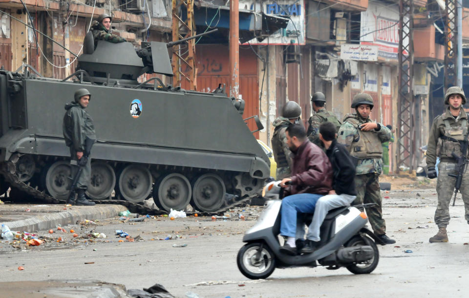 Lebanese army soldiers patrol a street in the northern Lebanese city of Tripoli on December 4, 2013 as the army deployed following clashes between supporters and opponents of Syria's regime. (IBRAHIM CHALHOUB/AFP/Getty Images)