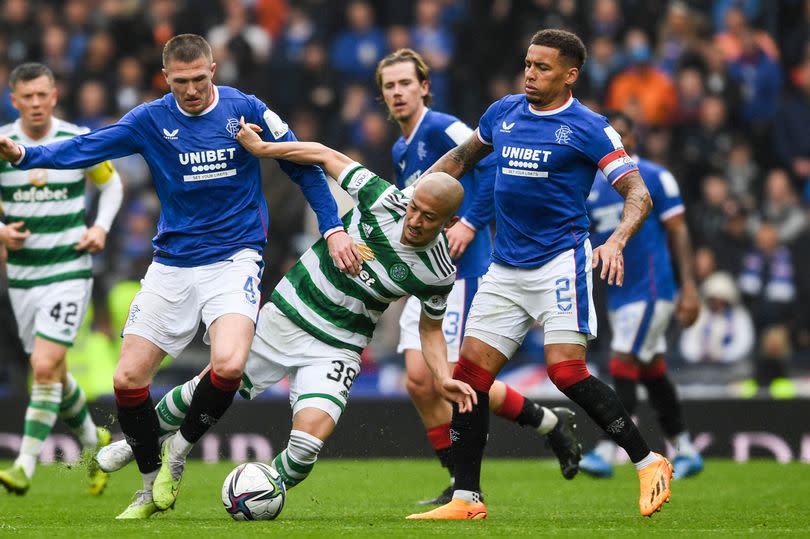 Celtic's Daizen Maeda is tackled by Rangers' John Lundstram -Credit:SNS Group