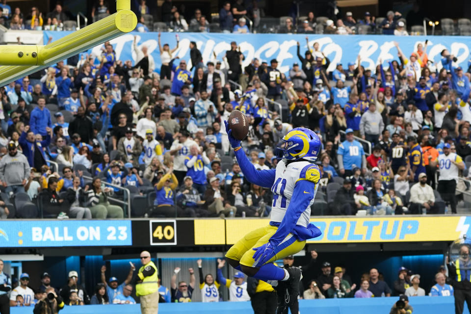 Los Angeles Rams running back Malcolm Brown (41) leaps in the end zone while celebrating his touchdown during the first half of an NFL football game against the Los Angeles Chargers Sunday, Jan. 1, 2023, in Inglewood, Calif. (AP Photo/Marcio Jose Sanchez)