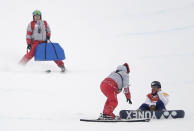 <p>Yuto Totsuka, of Japan, is helped by volunteers after crashing during the men’s halfpipe finals at Phoenix Snow Park at the 2018 Winter Olympics in Pyeongchang, South Korea, Wednesday, Feb. 14, 2018. (AP Photo/Gregory Bull) </p>