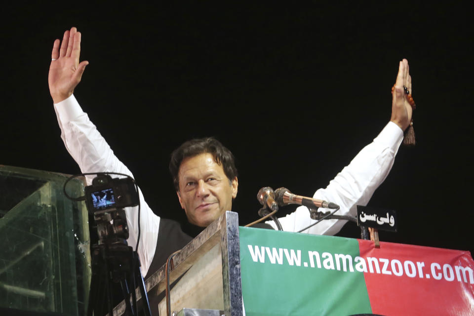 FILE - Former Pakistani Prime Minister Imran Khan waves to his supporters during an anti government rally, in Lahore, Pakistan, April 21, 2022. The Taliban win in Afghanistan gave a boost to militants in neighboring Pakistan. In April weeks of political turmoil in Pakistan unseated PrimeMinister Imran Khan who had been an advocate of negotiations with militants and had campaigned for the world to engage with the Taliban after their takeover in Afghanistan. (AP Photo/K.M. Chaudary, File)