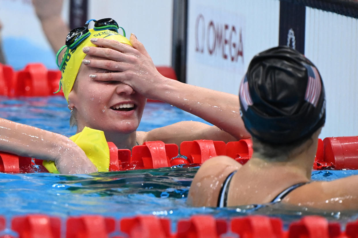 Australia's Ariarne Titmus (L) and USA's Kathleen Ledecky react after taking gold and silver respectively, in the final of the women's 400m freestyle swimming event during the Tokyo 2020 Olympic Games at the Tokyo Aquatics Centre in Tokyo on July 26, 2021. (Photo by Attila KISBENEDEK / AFP) (Photo by ATTILA KISBENEDEK/AFP via Getty Images)