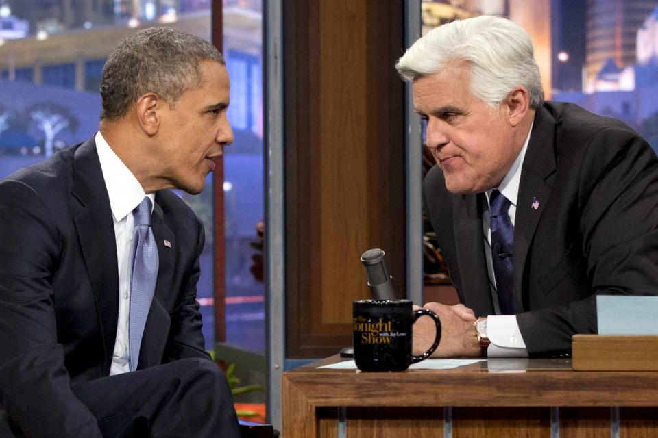 President Barack Obama, left, talks with Jay Leno during a commercial break during the taping of his appearance on “The Tonight Show with Jay Leno” in Los Angeles, Tuesday, Aug. 6, 2013. (AP Photo/Jacquelyn Martin)