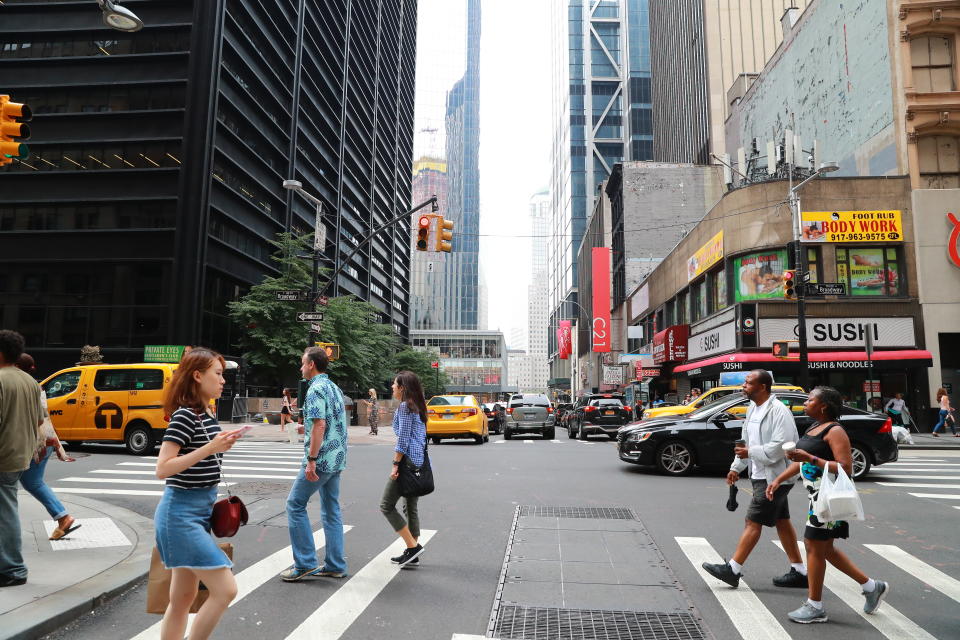 <p>Pedestrians walk across Broadway at the intersection of Cortlandt Street just down the street from the World Trade Center site on Aug. 12, 2017. (Photo: Gordon Donovan/Yahoo News) </p>