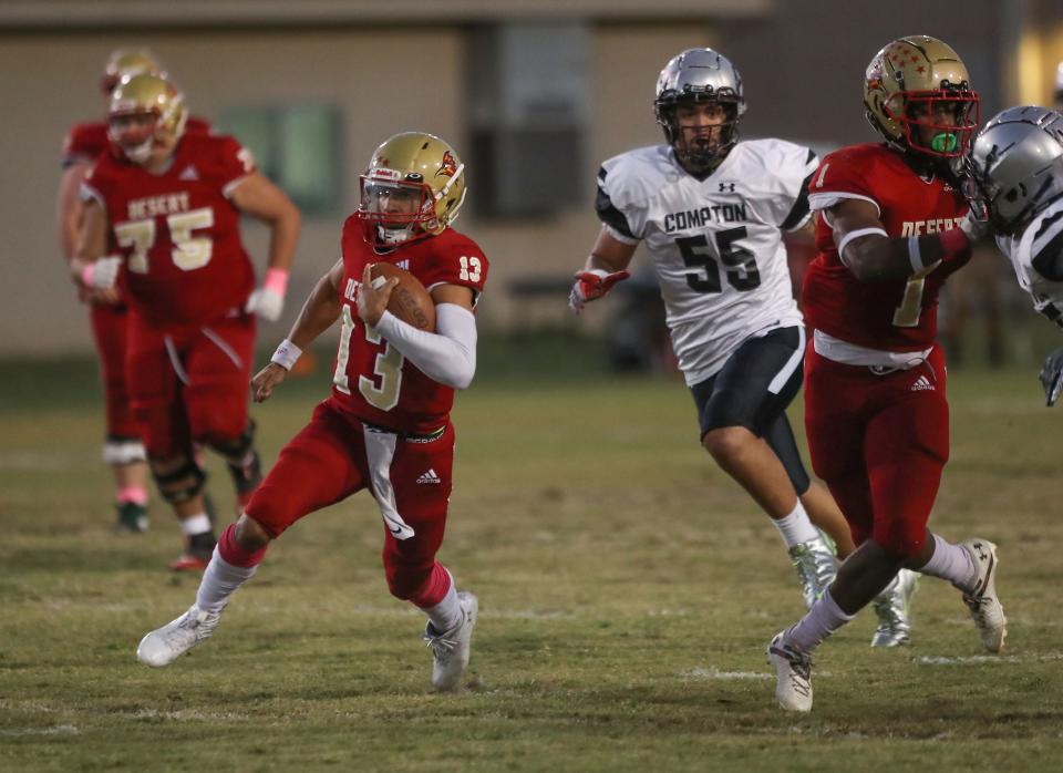 College of the Desert quarterback Cesar Vela runs against Compton in Palm Desert, Calif., Oct 22, 2022.