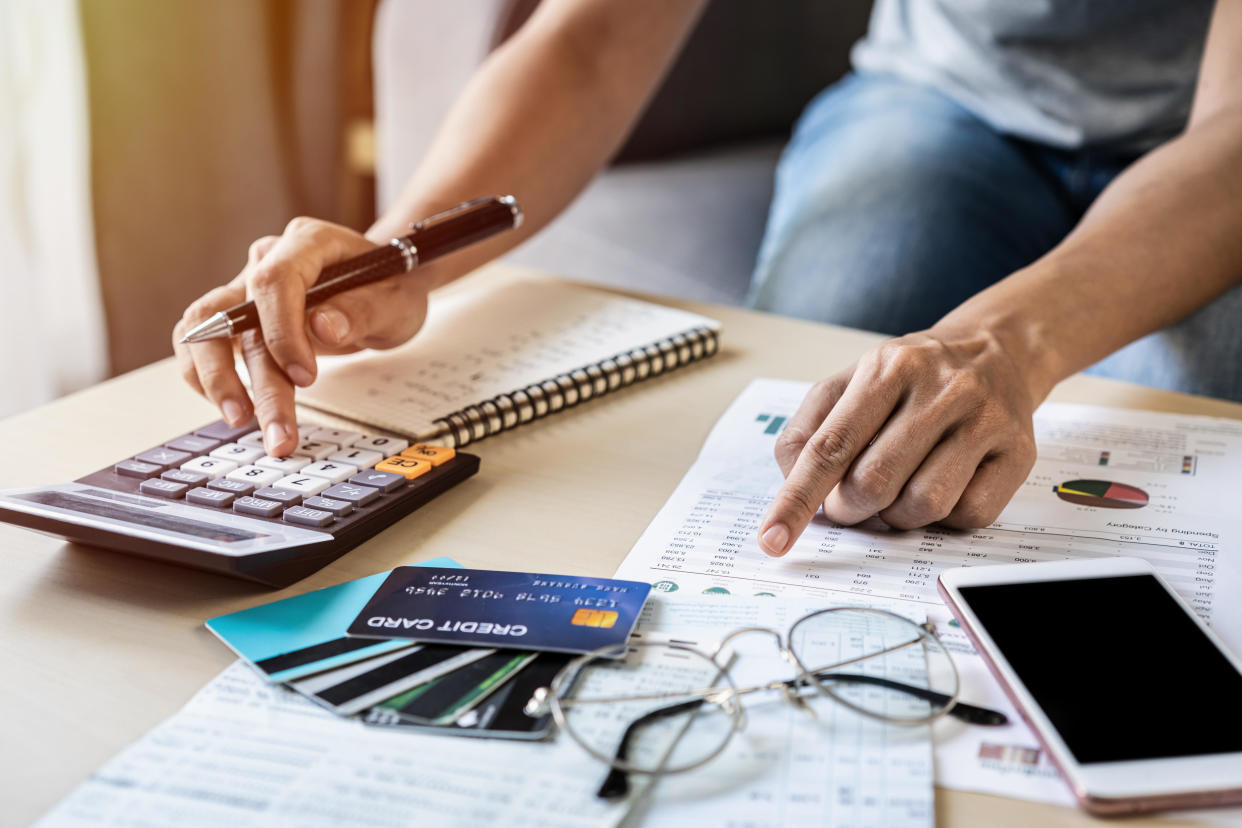 Balance transfer credit cards with low introductory rates can help ease the pain of interest payments and get you on track. / Credit: Kittiphan Teerawattanakul/EyeE