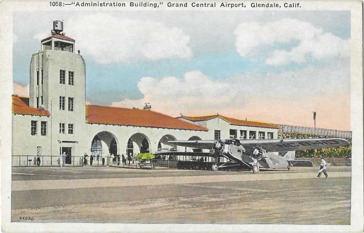 A tower and a building with tiled roof at Glendale&#39;s Grand Central Airport