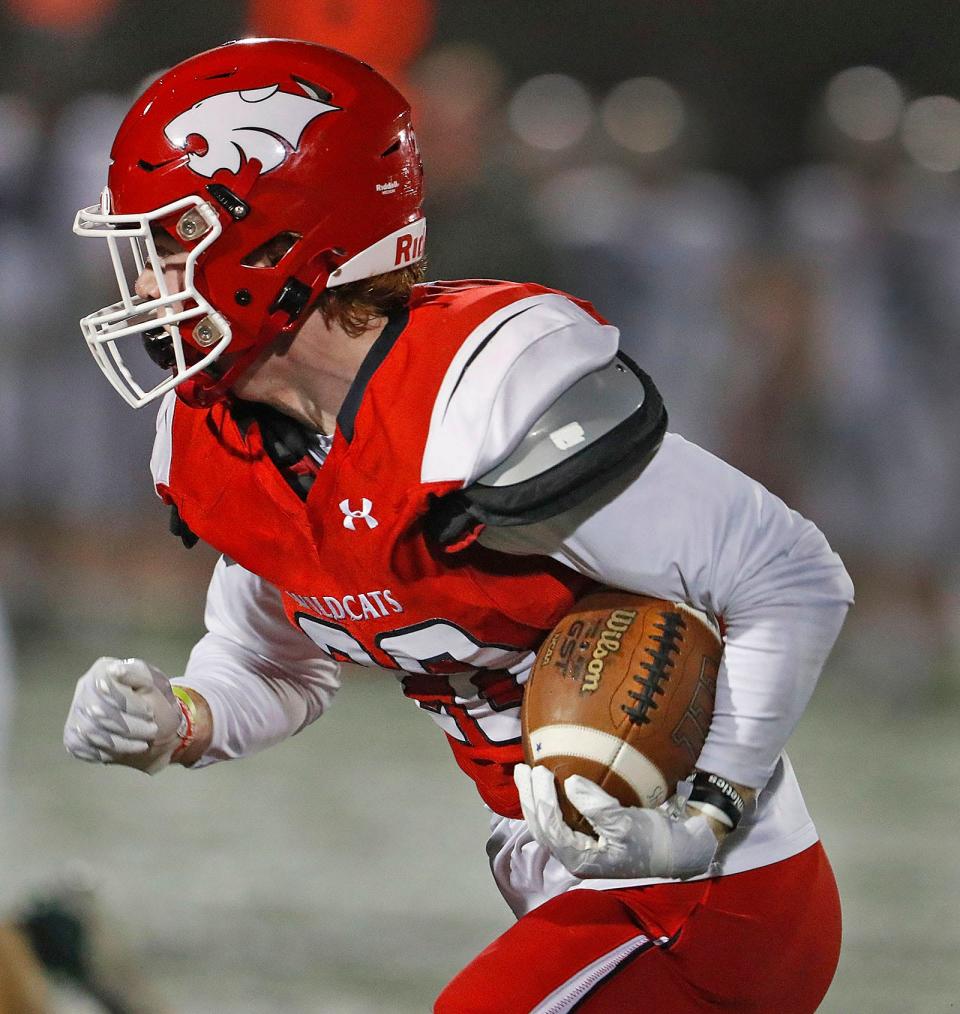 Milton wide receiver, captain Ferris Collins looks for a hole to run through the Dartmouth line.

Milton High hosted Dartmouth in MIAA playoff football action on Thursday, Nov. 9, 2023