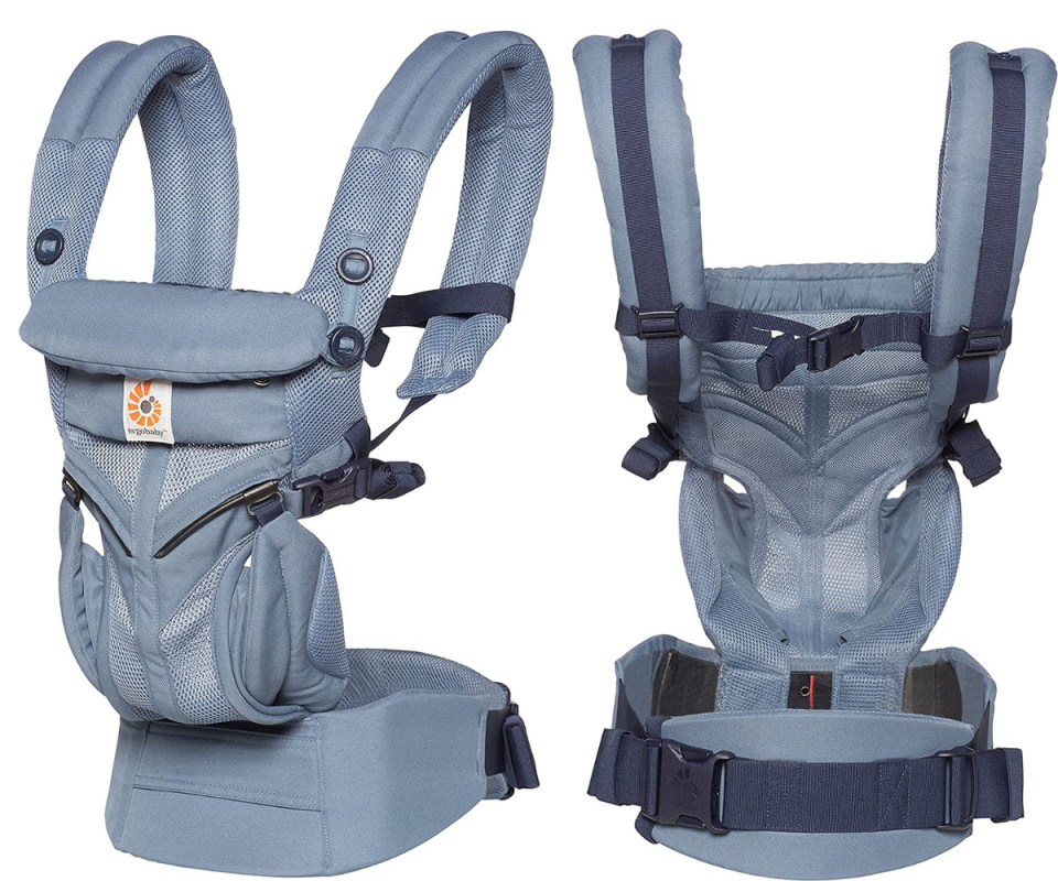 On the left, Ergobaby&#39;s pale navy baby carrier faces forward while on the right we see the back of it against a white background.