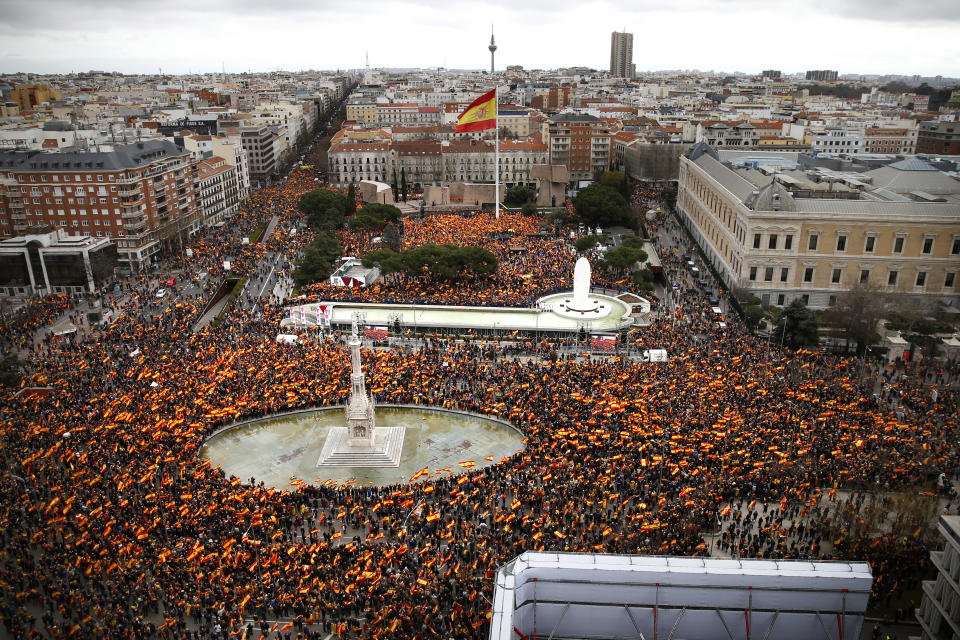 Thousands of demonstrators hold Spanish flags during a protest in Madrid, Spain, on Sunday, Feb.10, 2019. Thousands of Spaniards in Madrid are joining a rally called by right-wing political parties to demand that Socialist Prime Minister Pedro Sanchez step down. (AP Photo/Andrea Comas)