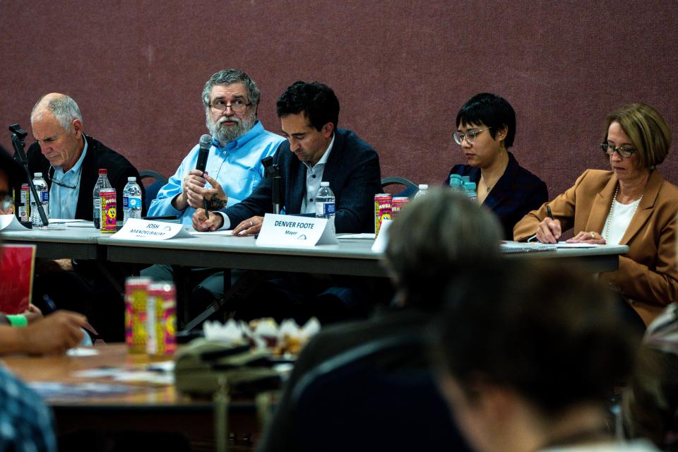 From left: at-large candidates Carl Voss and A J Drew and mayor candidates Josh Mandelbaum, Denver Foote, and Connie Boesen sit for a Des Moines candidate forum hosted by the Des Moines NAACP chapter at Corinthian Baptist Church on Tuesday, Oct. 17, 2023, in Des Moines.