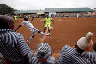 Kenyan prisoners watch a mock world cup soccer match between Russia and Saudi Arabia, as part of a month-long soccer tournament involving eight prison teams at the Kamiti Maximum Prison, Kenya's largest prison facility, near Nairobi, Kenya, June 14, 2018. REUTERS/Baz Ratner