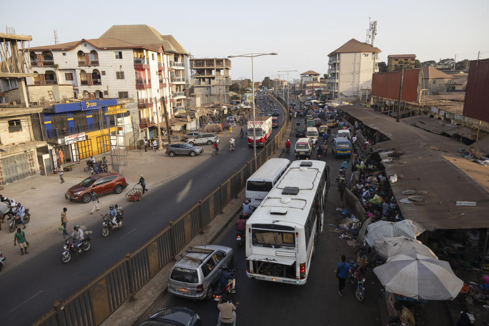 Traffic travels along a street in Conakry, Guinea, Monday, April 8, 2024. (AP Photo/Misper Apawu)