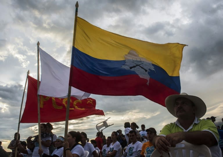 Members of the Revolutionary Armed Forces of Colombia (FARC) attend the announcement of the approval of the peace deal with the government during the 10th National Guerrilla Conference in Llanos del Yari, Colombia, on September 23, 2016