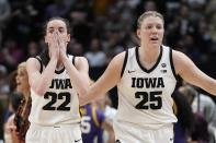 Iowa's Caitlin Clark and Monika Czinano react during an officials time out during the second half of the NCAA Women's Final Four championship basketball game against LSU Sunday, April 2, 2023, in Dallas. (AP Photo/Tony Gutierrez)