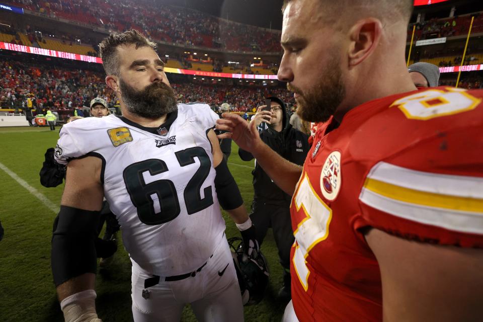 Jason Kelce #62 of the Philadelphia Eagles talks to brother Travis Kelce #87 of the Kansas City Chiefs after their game at GEHA Field at Arrowhead Stadium on November 20, 2023 in Kansas City, Missouri