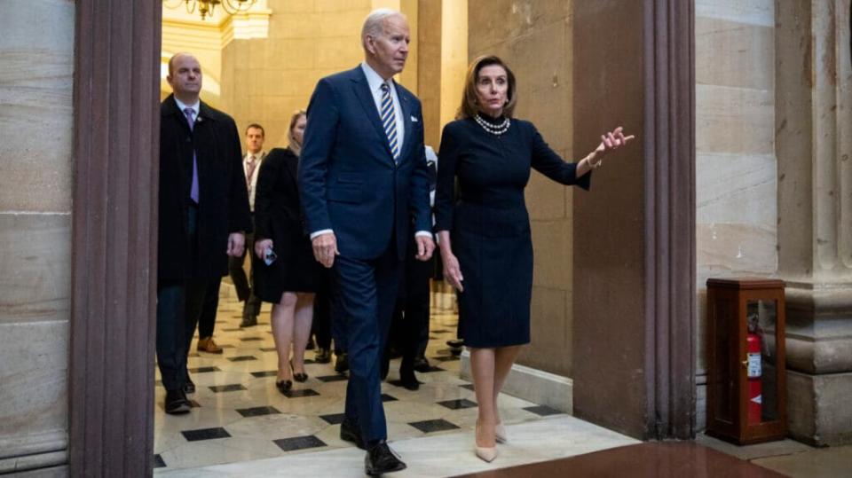 (L-R) President Joe Biden and Speaker of the House Nancy Pelosi walk through the Rotunda after Biden his respects to the late Rep. Don Young (R-AK) while lying in state in Statuary Hall at the U.S. Capitol March 29, 2022 in Washington, DC. (Photo by Drew Angerer/Getty Images)