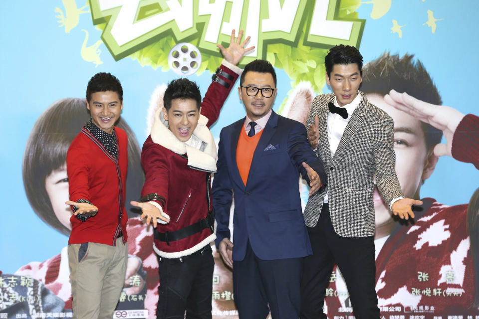 In this Jan. 25, 2014 photo, actors, from left to right, Tian Liang, Jimmy Lin, Guo Tao, and Zhang Liang, pose for photos at a press conference for movie “Dad, Where Are We Going?” in Beijing, China. The movie about the relationships between celebrity fathers and their young children is the latest Chinese TV program to attempt to cross over onto the big screen, as entertainment companies try to capitalize on the success of hit shows. (AP Photo) CHINA OUT
