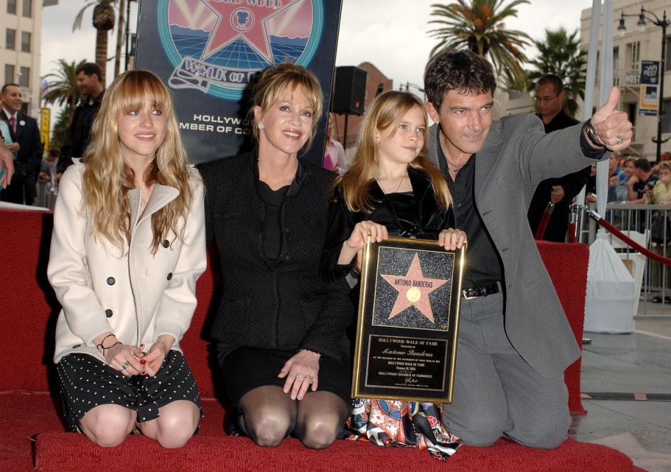 Dakota Johnson, actress Melanie Griffith, Stella Banderas pose with actor Antonio Banderas as he receives his star on the Hollywood Walk of Fame on Hollywood Boulevard, 2005 (Getty Images)