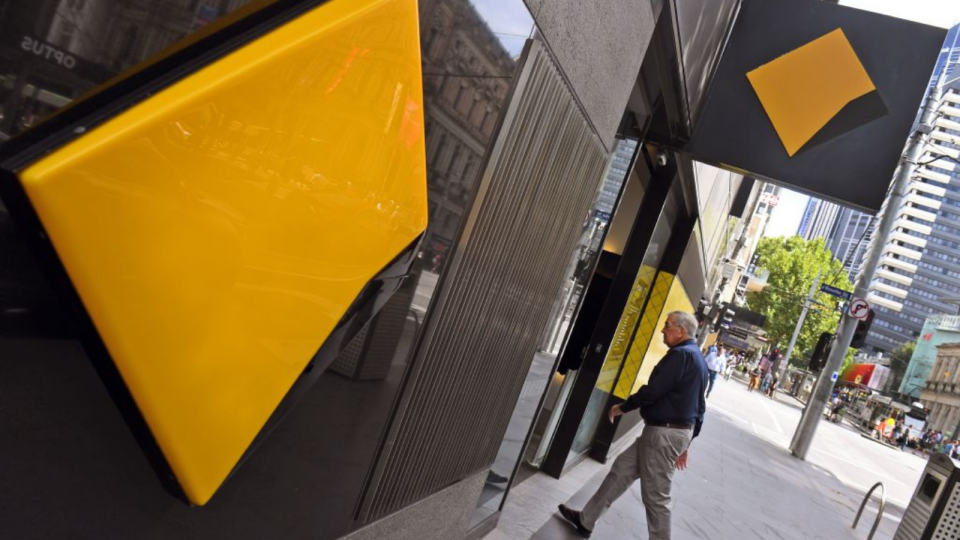 Man walks into Commonwealth Bank branch. 