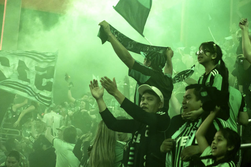 Austin FC fans celebrate a goal by Maximiliano Urruti during the second half of an MLS soccer game to defeat CF Montreal, Saturday, March 4, 2023, in Austin, Texas. Austin won 1-0. (AP Photo/Michael Thomas)
