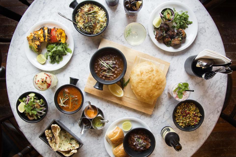 Bombay-style: A spread at popular Indian restaurants Dishoom, which reopens three London locations on July 10