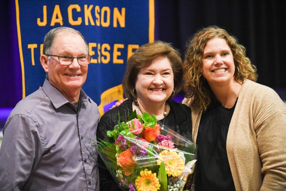 Judy Renshaw poses for a photo with family after being awarded the 2023 Woman of the Year by the Jackson Rotary Club on Wednesday, Feb. 21, 2024.