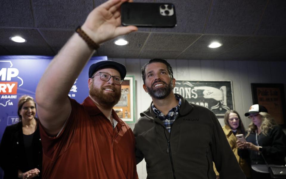 Donald Trump Jr takes a picture with a fan after his speech