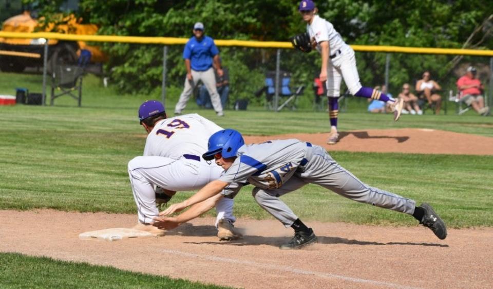 Ida baserunner Gabe Weaver scrambles back to first base has Brenden Holland delivers a pick-off throw to first baseman Henry Smith. Blissfield came from behind to win the Division 3 District game 5-4 Tuesday.