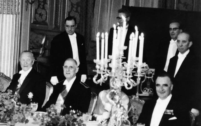 Then French president Charles de Gaulle, centre, then prime minister Georges Pompidou, right, and West German then chancellor Konrad Adenauer at the Elysee presidential palace after a Germano-French treatywas signed in 1963
