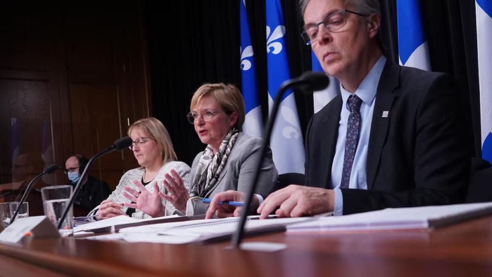 Qubec’s auditor general, Guylaine Leclerc, centre, criticized Hydro-Québec in her December 2022 report. 
