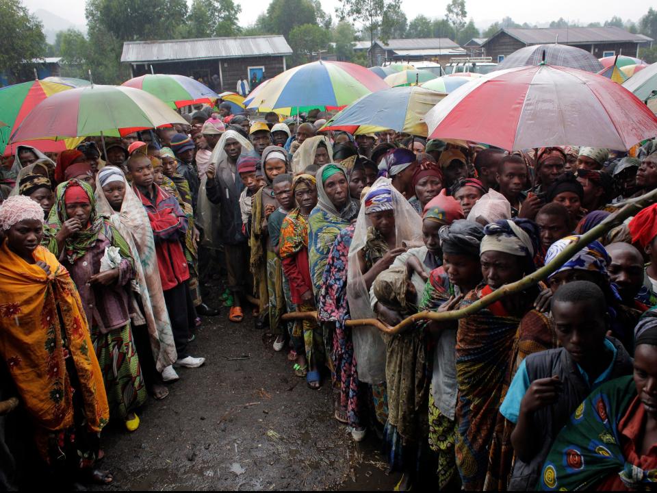 People in Kibati, eastern Congo, wait for World Food Programme supplies to be distributed in 2012 (AP)