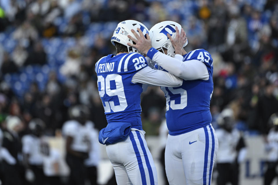 Duke place kicker Todd Pelino (29) is greeted by long snapper Evan Deckers (45) after making a field goal during the second half of the Military Bowl NCAA college football game against UCF, Wednesday, Dec. 28, 2022, in Annapolis, Md. (AP Photo/Terrance Williams)