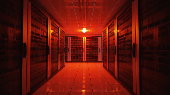 A data center illuminated by a red light.