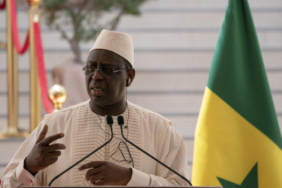 Senegal's President Macky Sall speaks during a press conference after a meeting with Spanish Prime Minister Pedro Sanchez at the presidential palace in Dakar, Senegal, Friday, April 9, 2021. Sanchez is on a mini-tour to Angola and Senegal that are key in the European country's new push to bolster ties with the neighboring continent and mitigate the migration flows that many fear could increase as a consequence of the coronavirus pandemic. (AP Photo/Leo Correa)