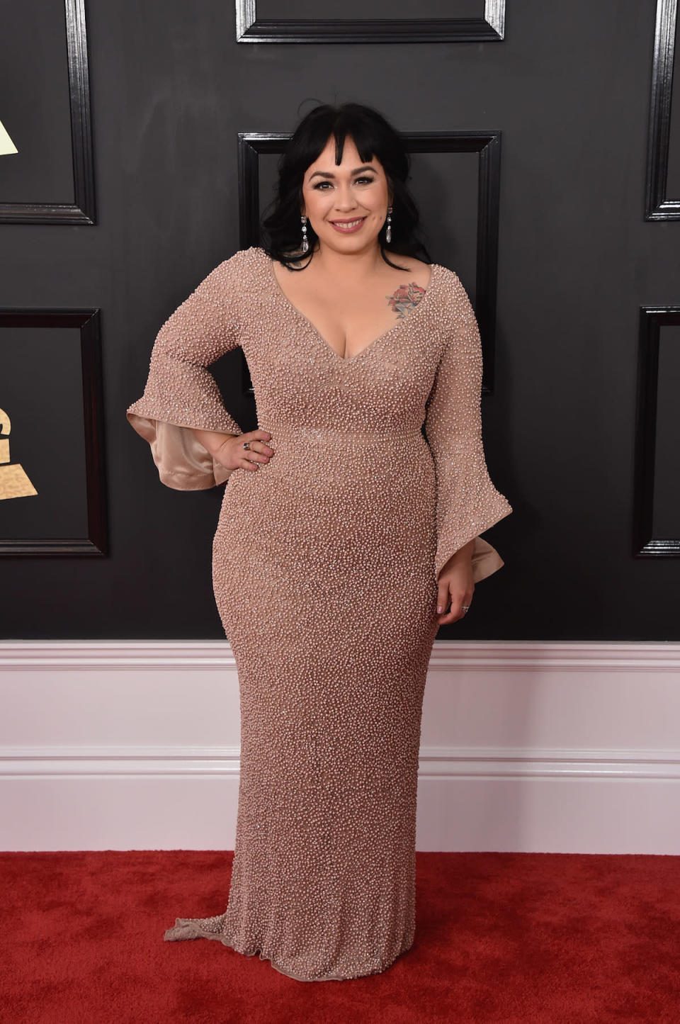 <p>The singer’s chest tattoo peeked out of her plunging neckline. (Photo by John Shearer/WireImage) </p>