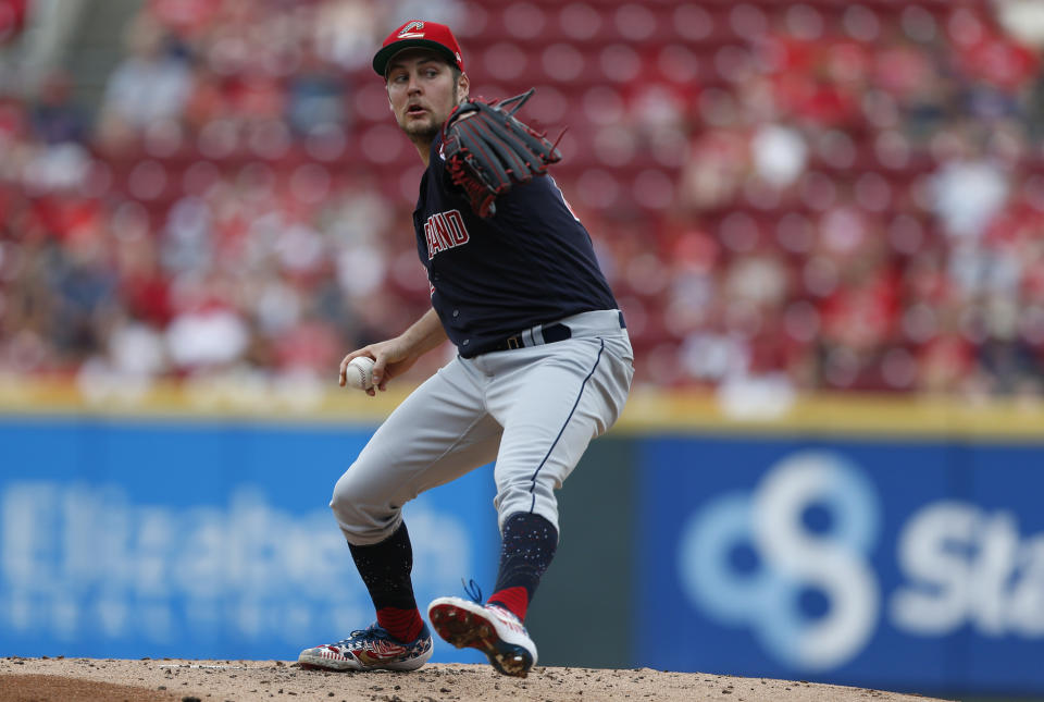 Cleveland Indians starting pitcher Trevor Bauer throws against the Cincinnati Reds during the first inning of a baseball game, Sunday, July 7, 2019, in Cincinnati. (AP Photo/Gary Landers)