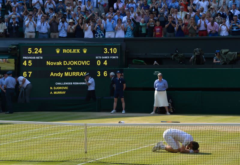 Andy Murray of Britain celebrates as he defeats Novak Djokovic of Serbia in their men's singles final tennis match at the Wimbledon Tennis Championships, in London
