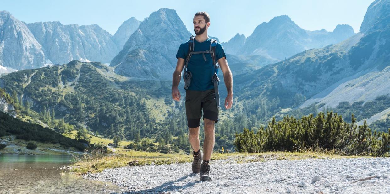 austria, tyrol, man hiking at seebensee lake