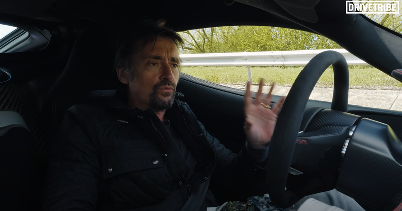 Richard Hammond gestures while sitting in a Rimac Nevera